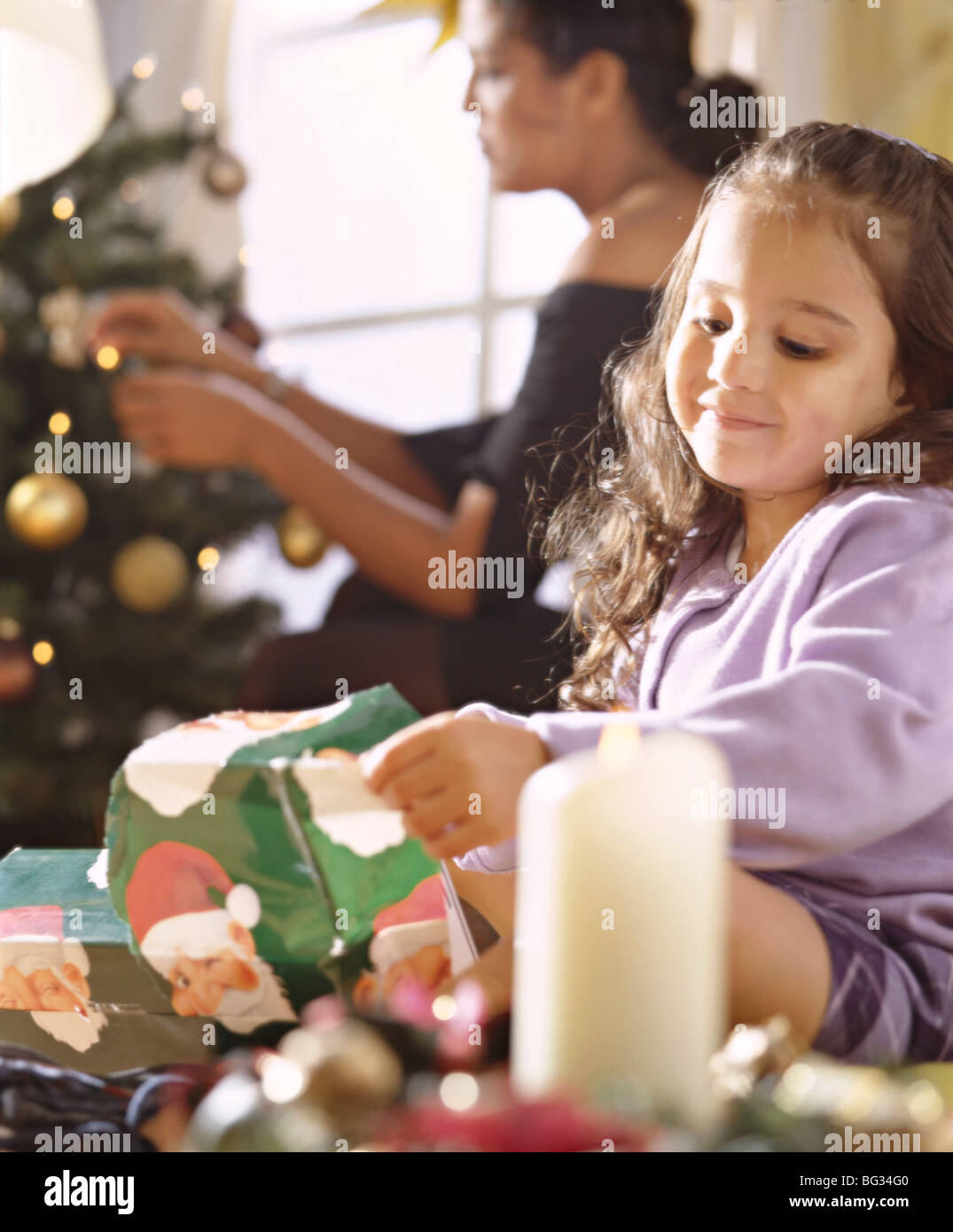 Mother and daughter decorating for Christmas